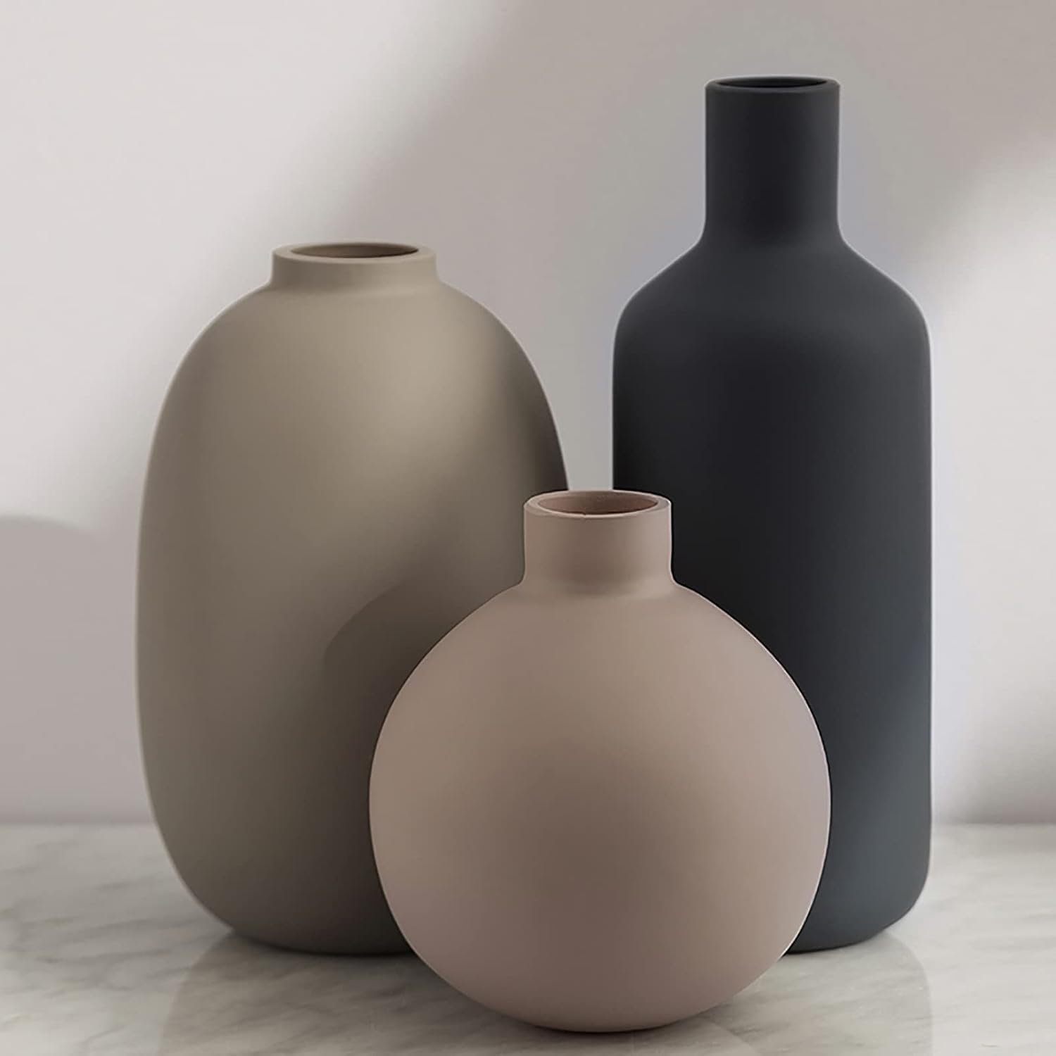 Three-piece neutral tone ceramic display jars, soft countryside contemporary style, compact ornaments for tabletops, lounge spaces, shelves and entry styling