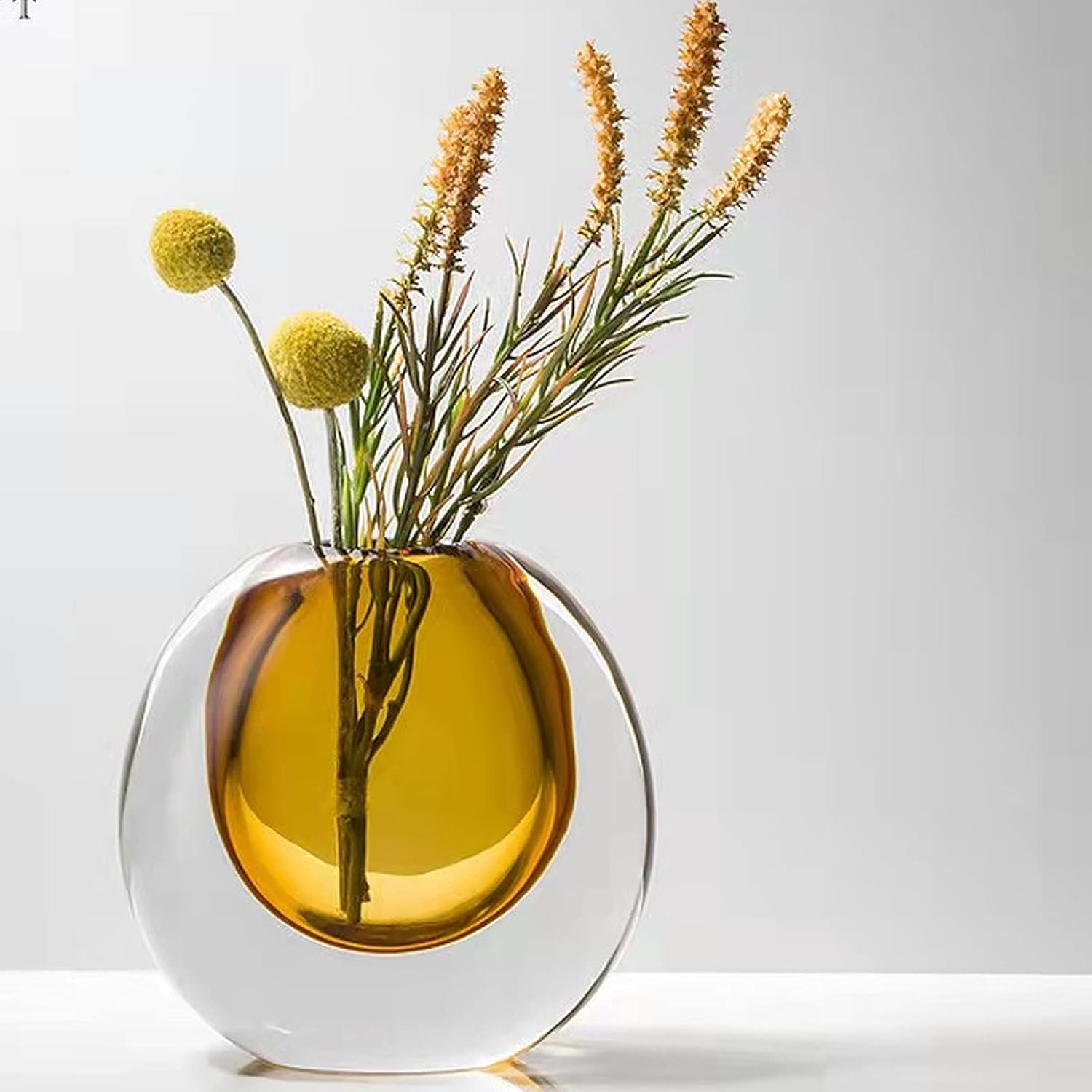 Amber tinted crystal bloom vessel, sleek understated light luxury design, fits interior focal styling, workspaces, reed grass and dried flower displays