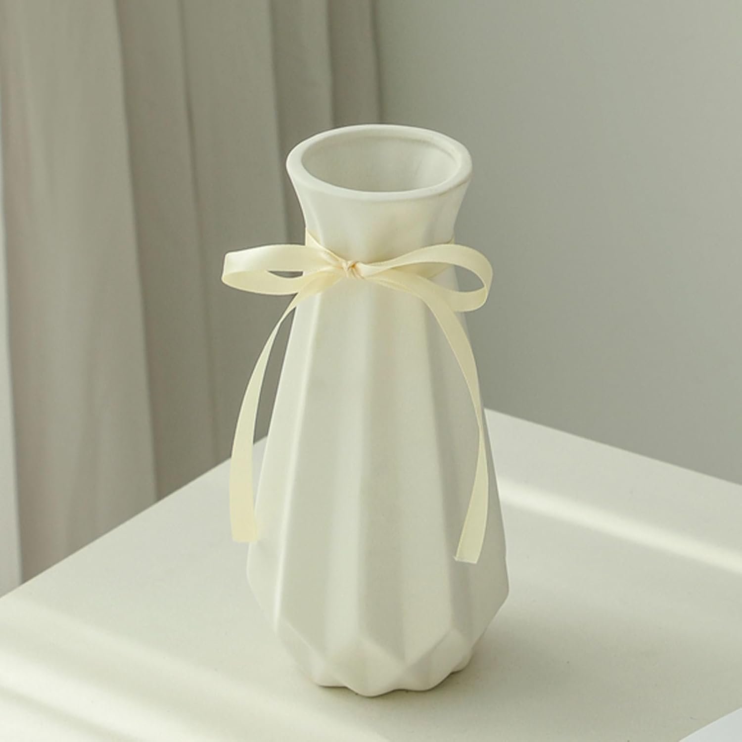 Geometric folded shape ceramic flower vessel with fabric accent, artistic structured design decorative jar for contemporary indoor styling