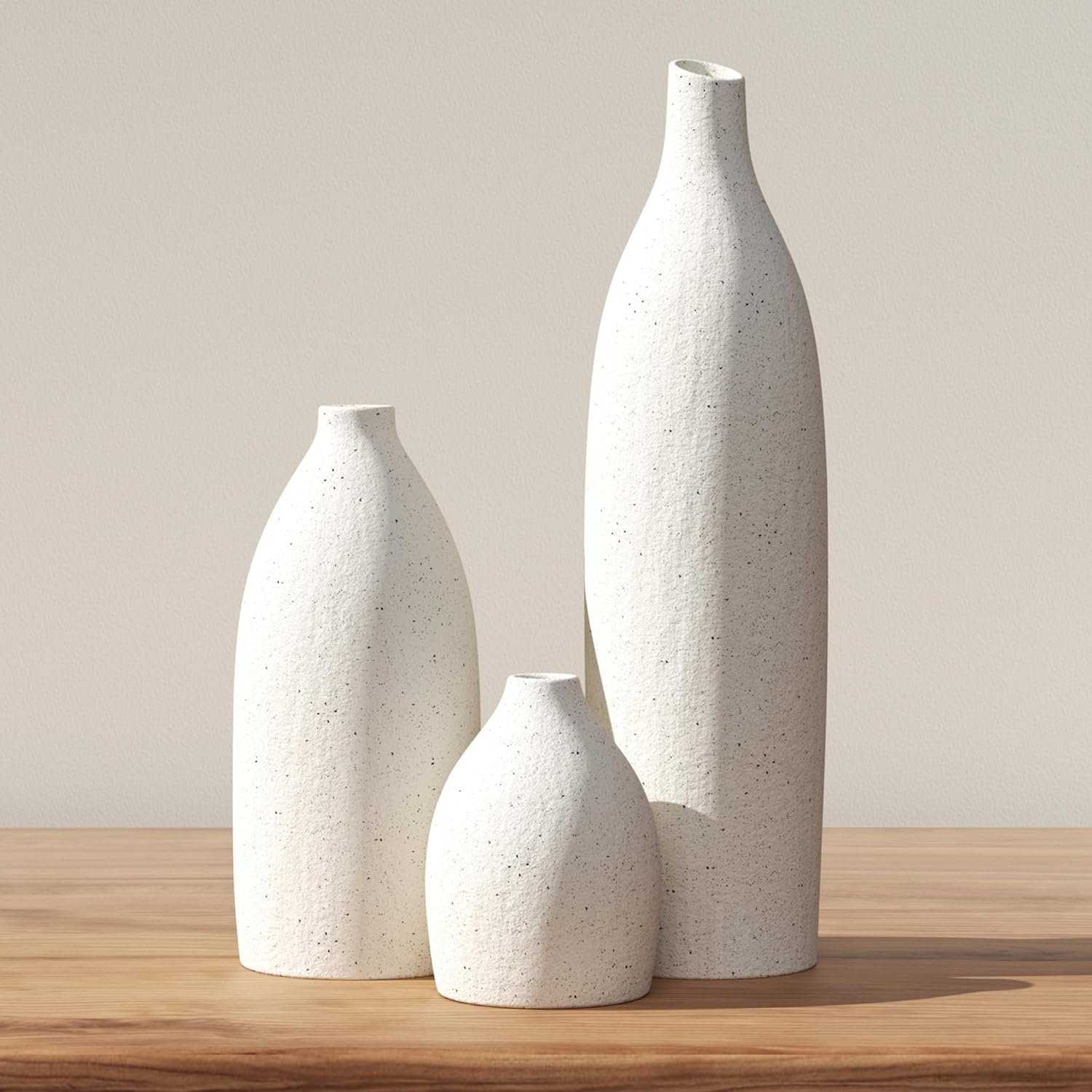 Three-piece cream matte clay ceramic vase set, plain northern contemporary design, decorative holders for tabletops, fireplace mantels, hall consoles and dining island focal layouts